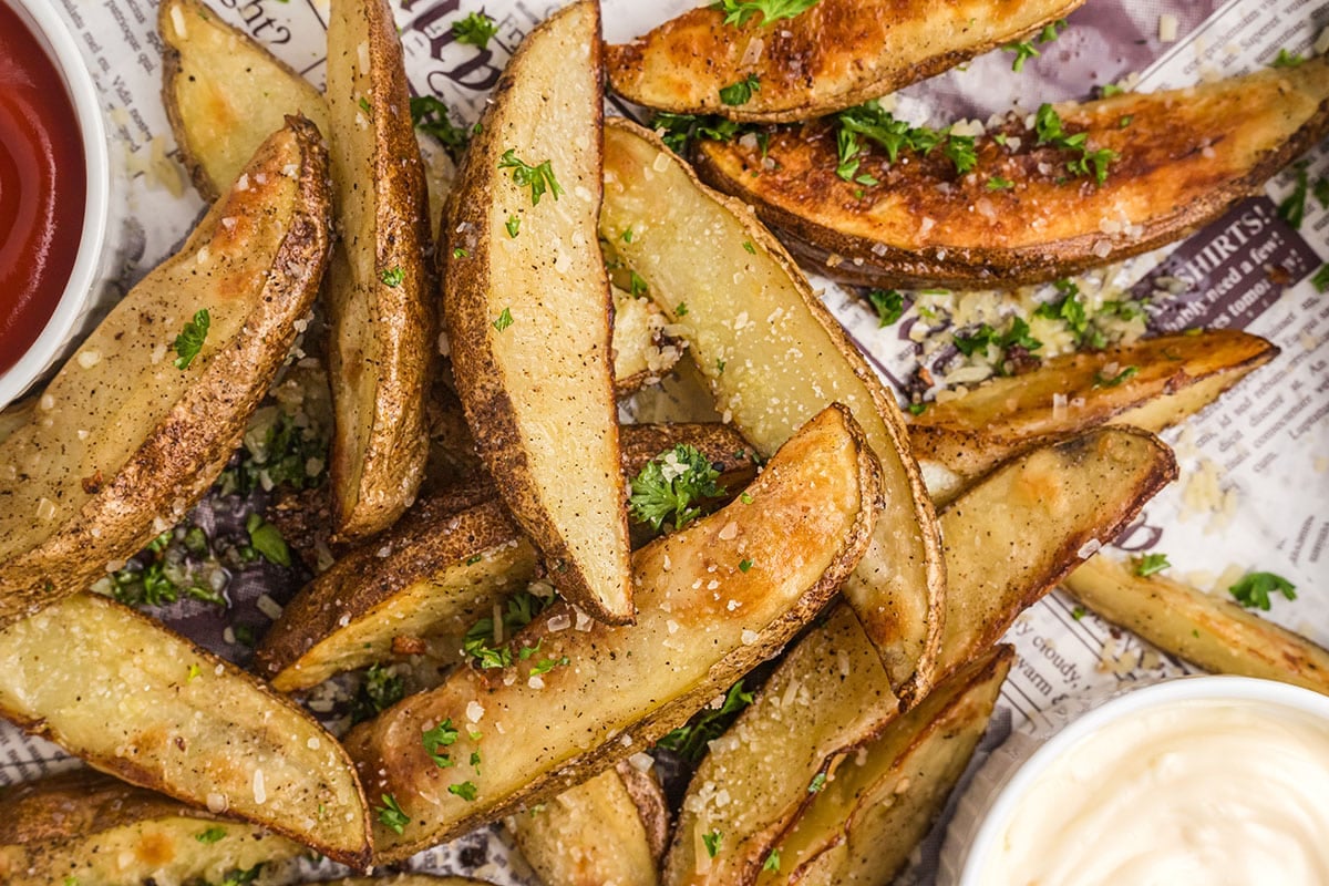 close up overhead shot of parmesan truffle potato wedges