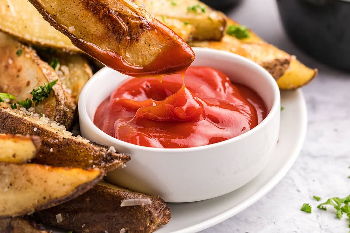 truffle fry dipping into ketchup