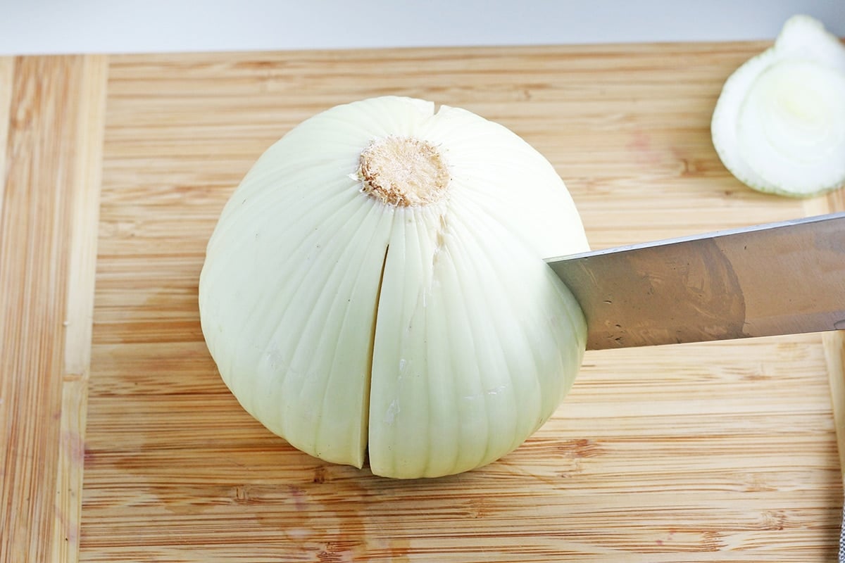 knife cutting into onion