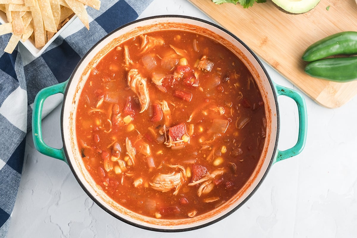 cooked chicken tortilla soup in a dutch oven