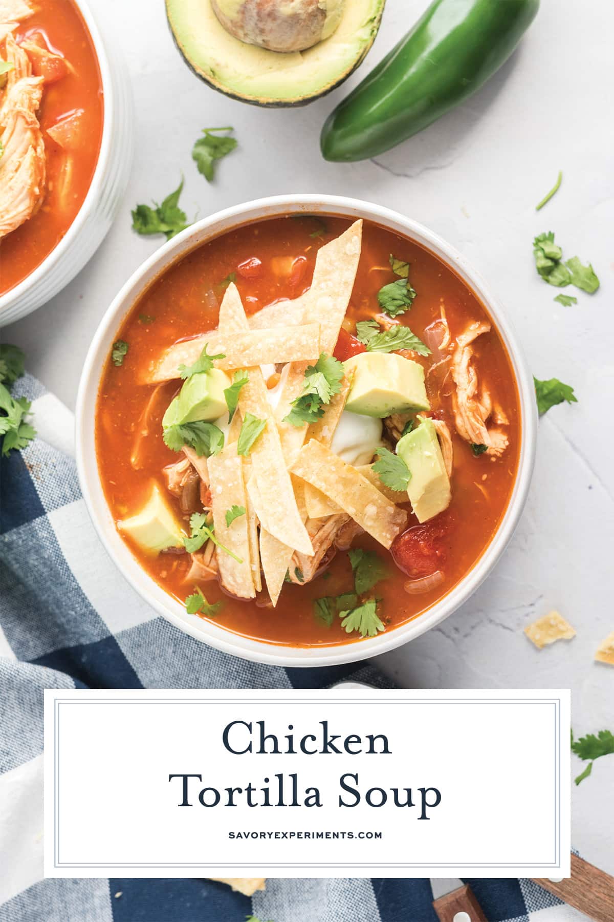 overhead of soup bowl with tomato based chicken soup