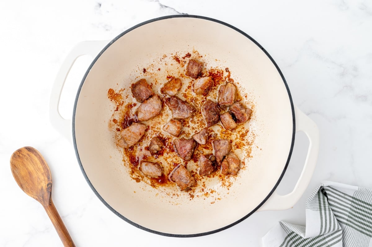 browned pork pieces in pot