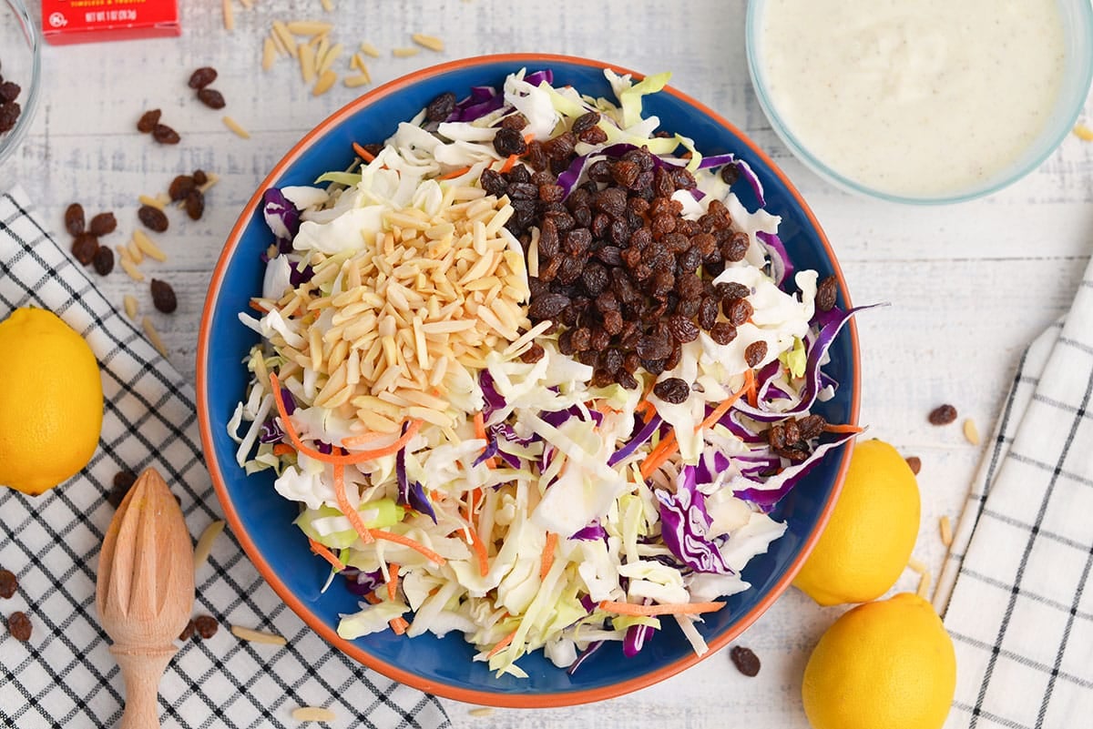 overhead shot of slaw mix with almonds and raisins