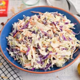 angled shot of bowl of creamy coleslaw