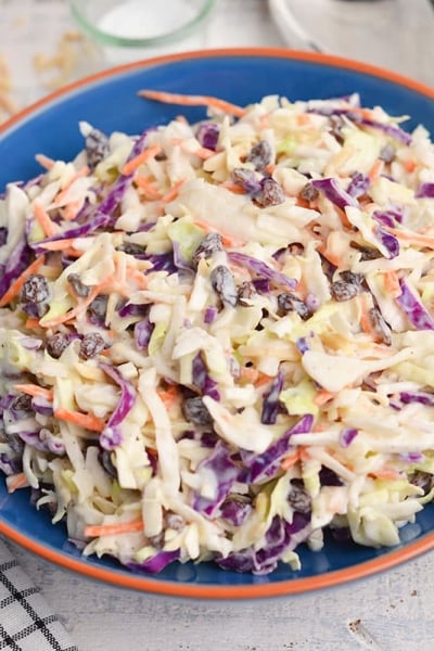 angled shot of bowl of creamy coleslaw