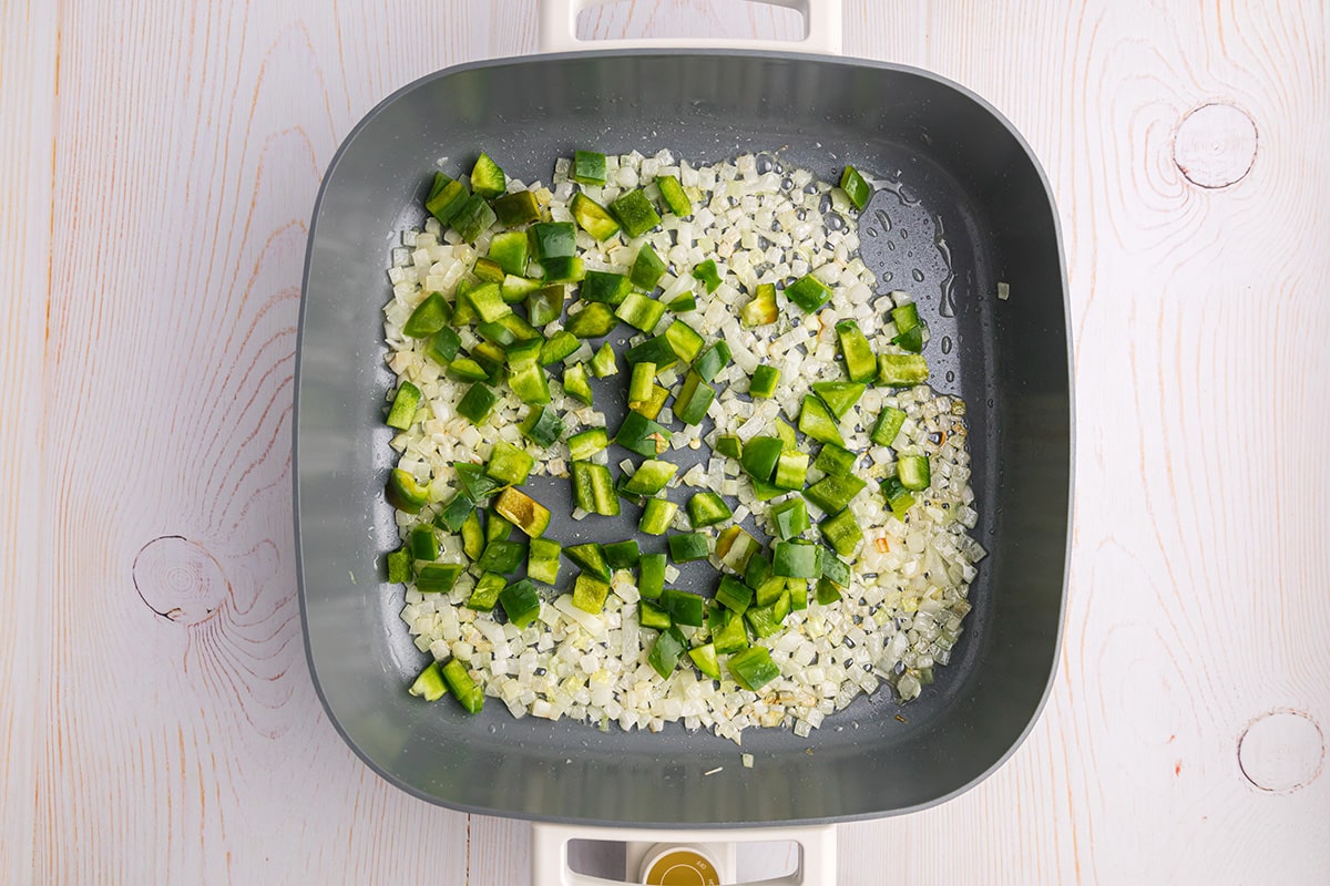 green peppers and onions in pan