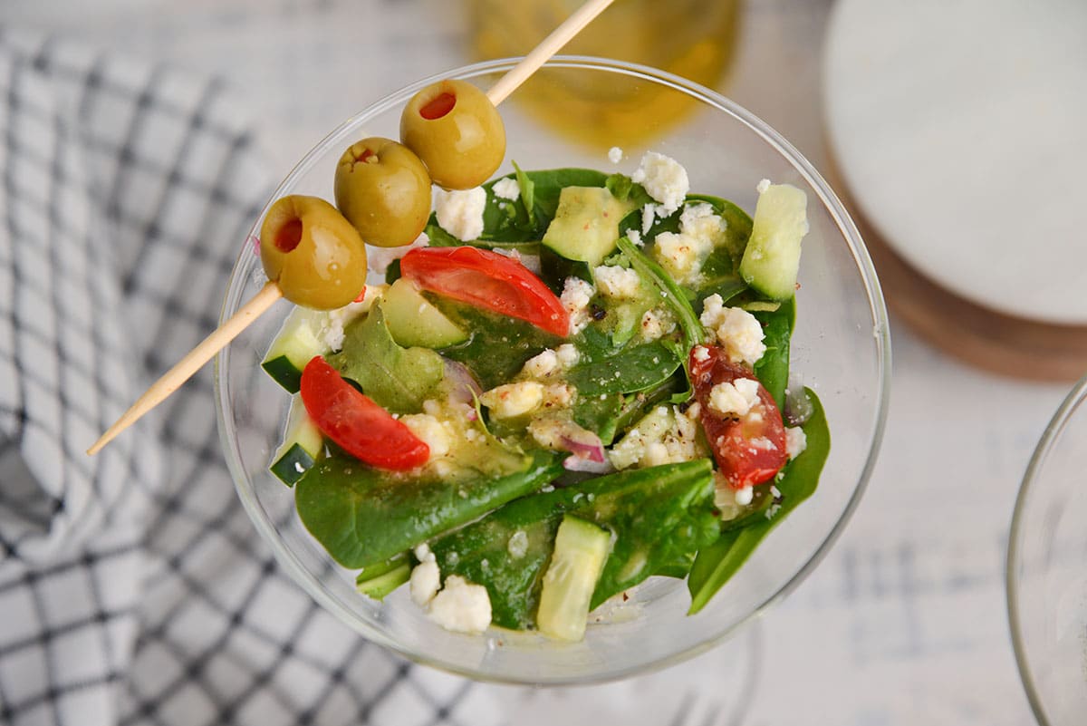 close up of salad in martini glass