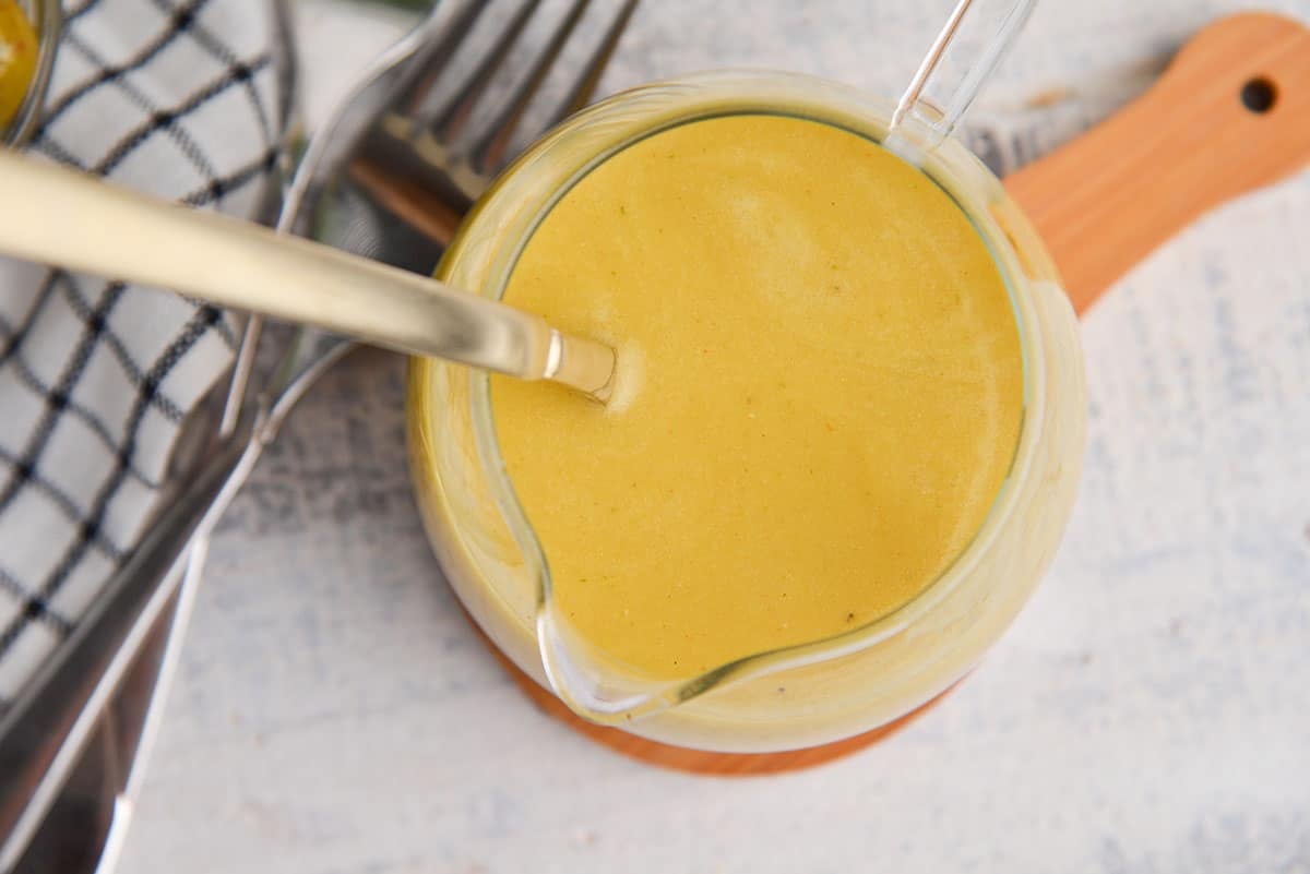 overhead shot of dirty martini salad dressing in jar