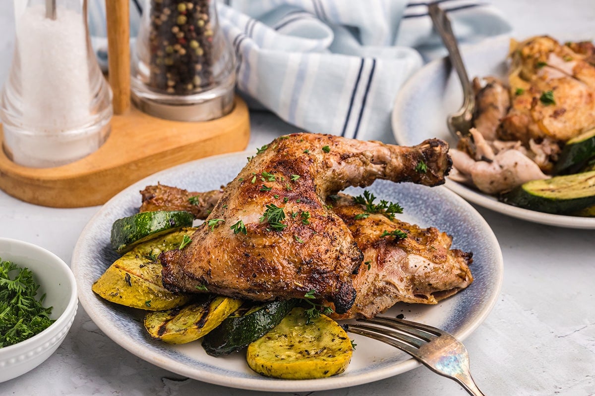 plate of fireman chicken with squash and zucchini