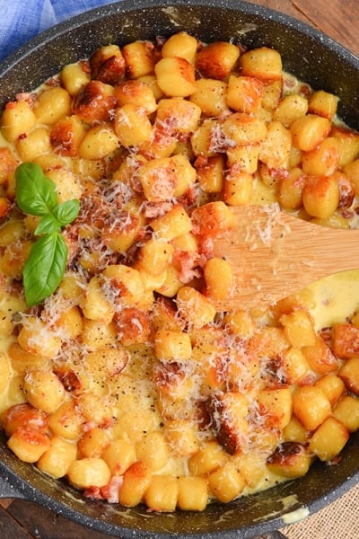 overhead shot of gnocchi carbonara in pan