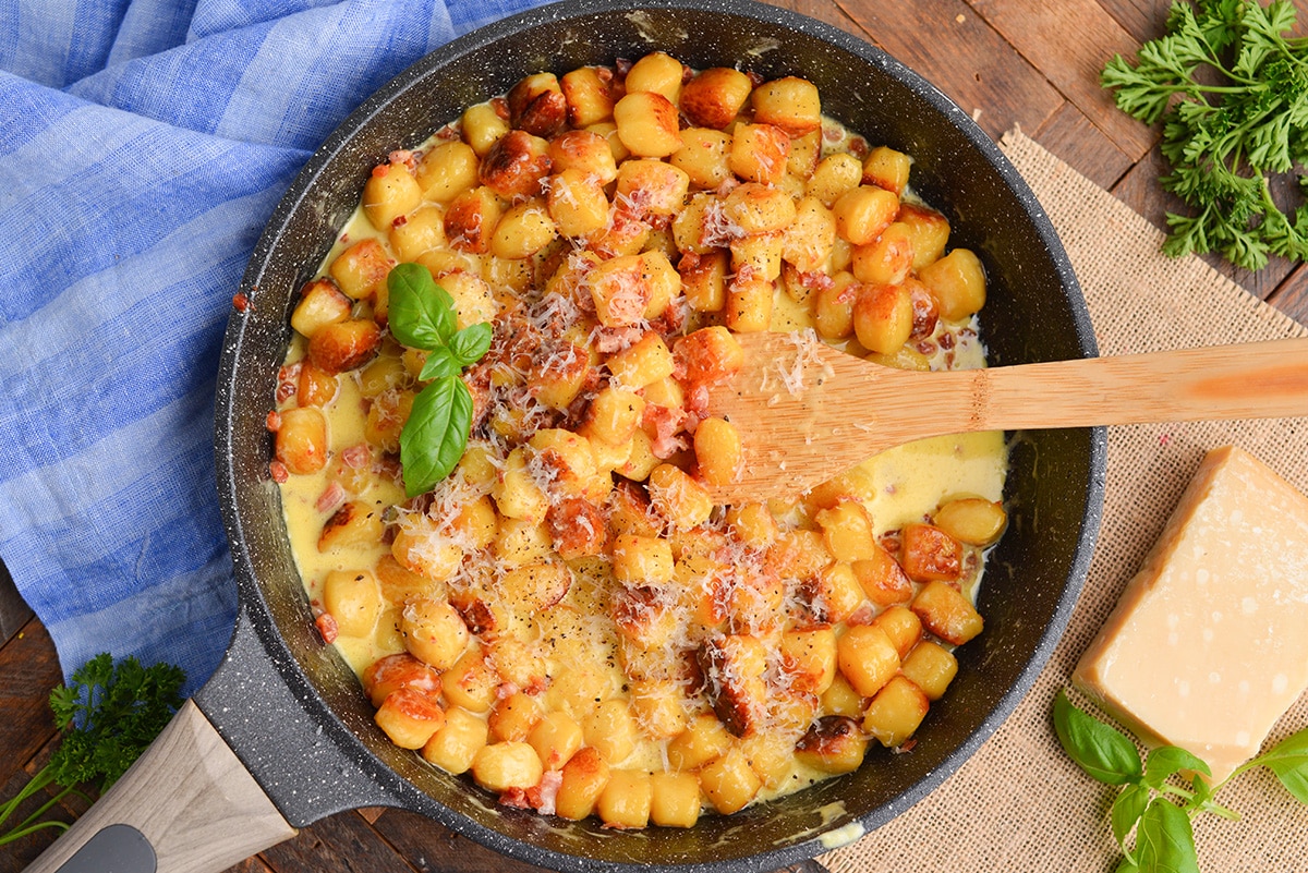 overhead shot of gnocchi carbonara in pan