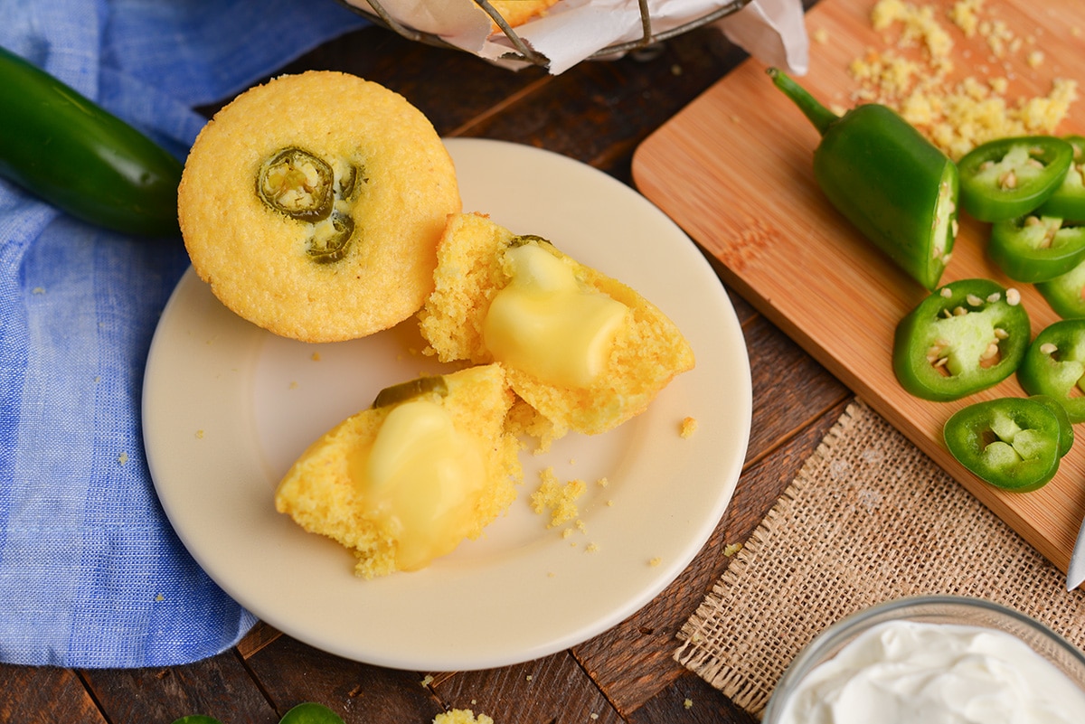 cornbread muffin cut in half and topped with butter