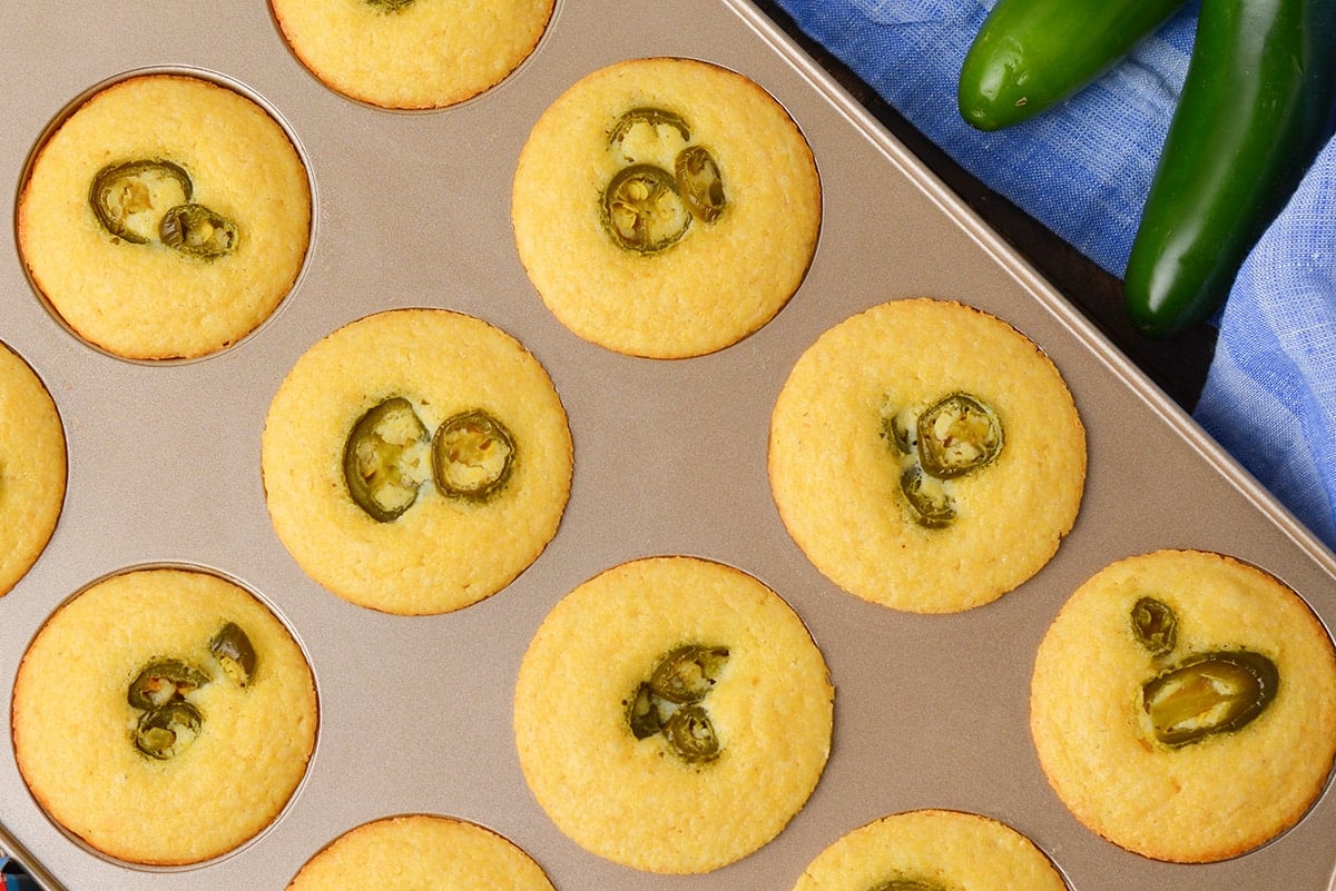 close up of jalapeno cornbread muffins in a pan