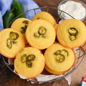 angled shot of basket of corn bread muffins