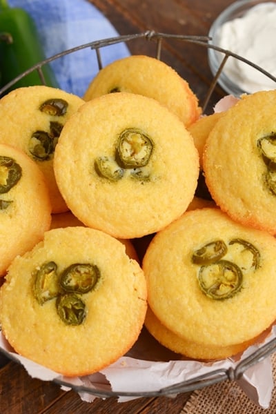 angled shot of basket of corn bread muffins