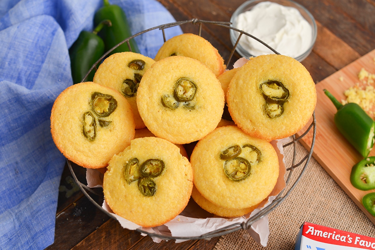 angled shot of basket of corn bread muffins