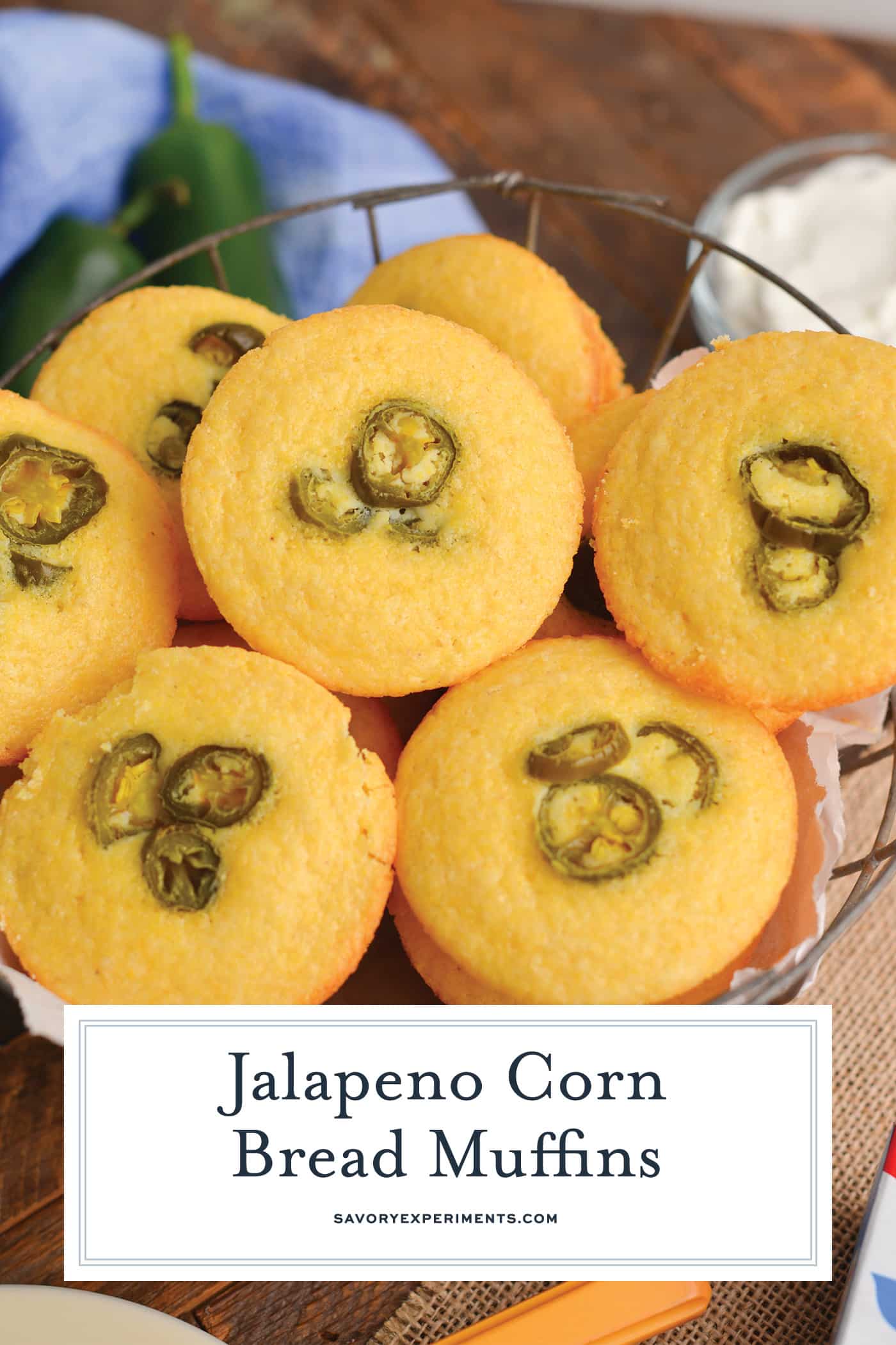 angled shot of basket of corn bread muffins with text overlay for pinterest