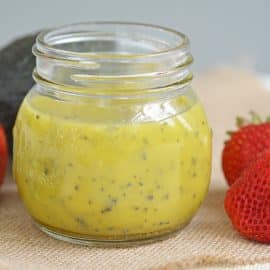 a jar of poppyseed dressing on burlap