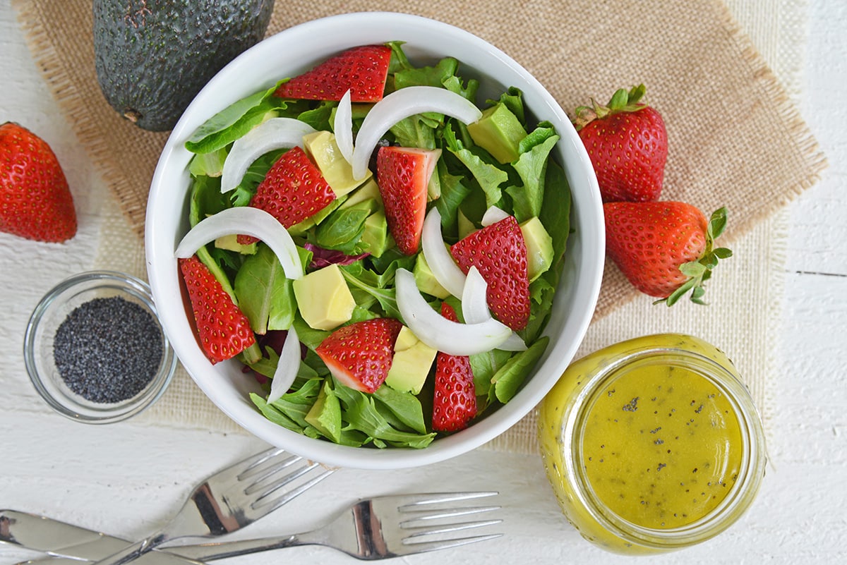 overhead shot of salad with poppy seed dressing