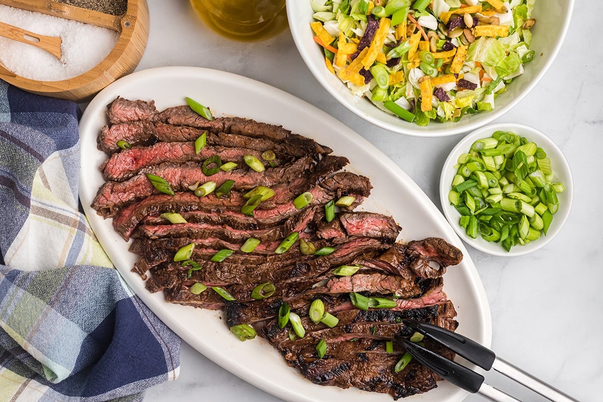 sliced skirt steak on a platter