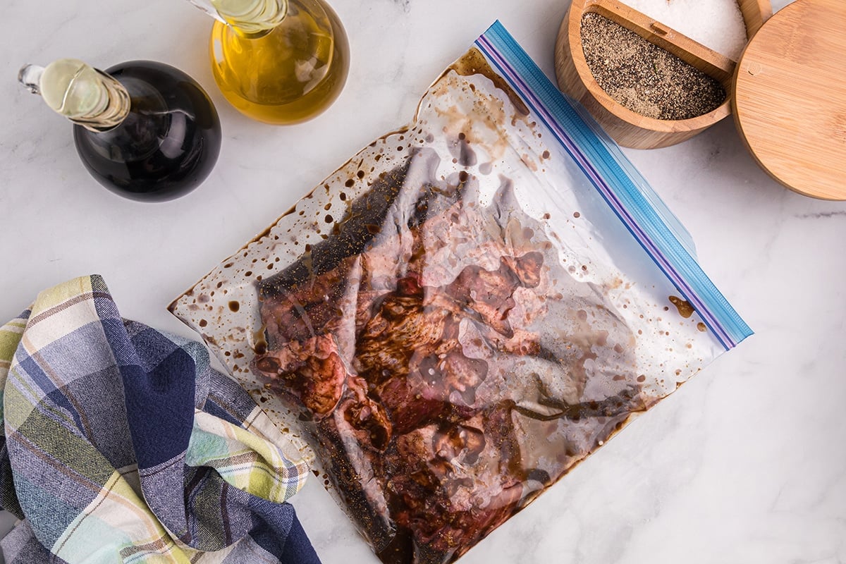 skirt steak marinading in plastic bag