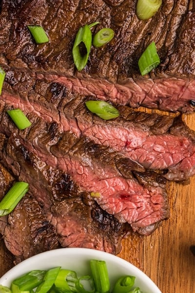 sliced skirt steak marinade on cutting board