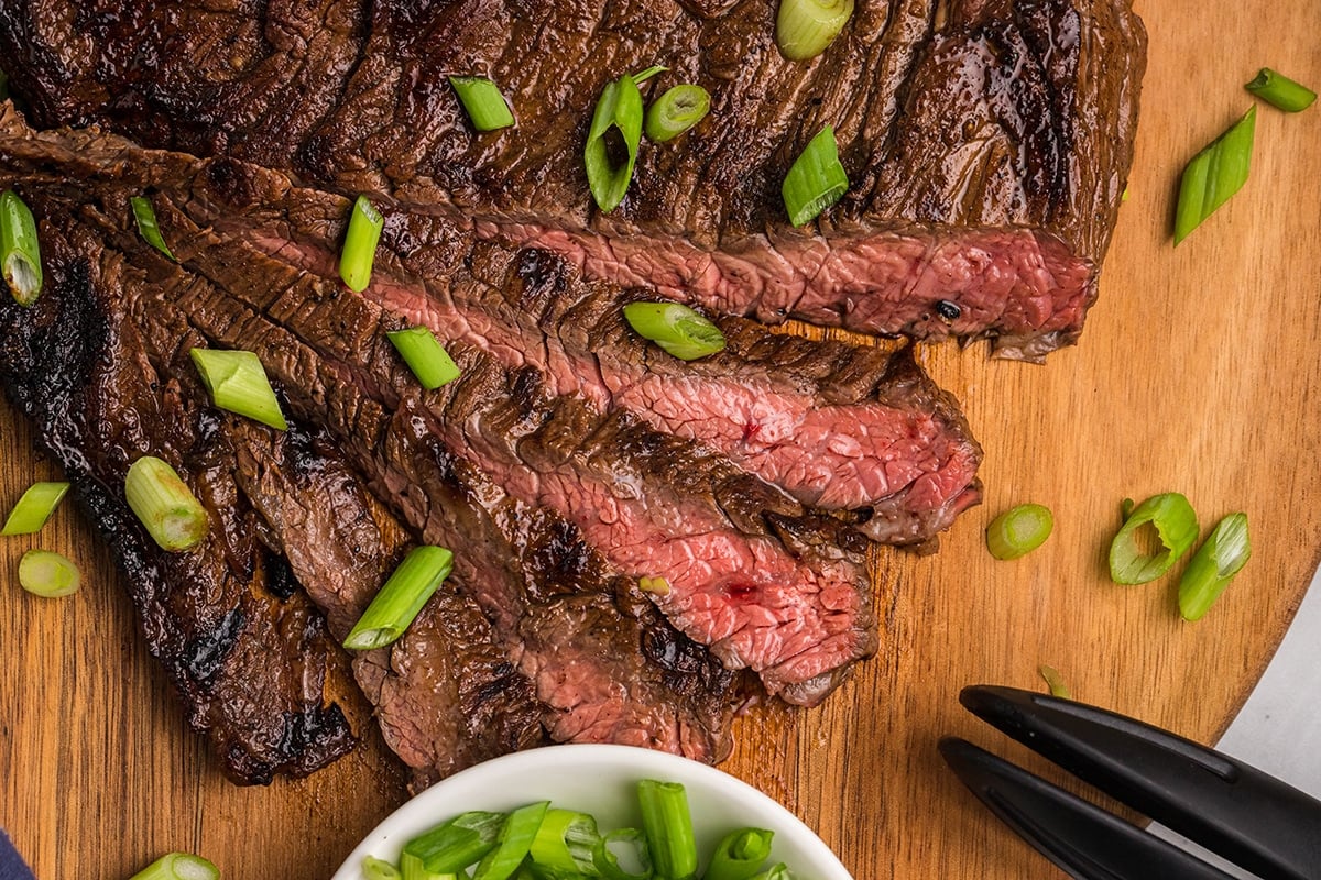 sliced skirt steak marinade on cutting board