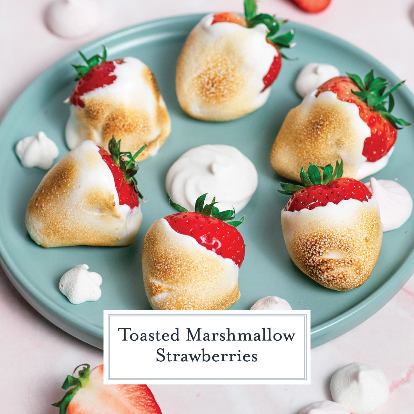 angled shot of toasted marshmallow strawberries on a blue plate with text overlay for facebook