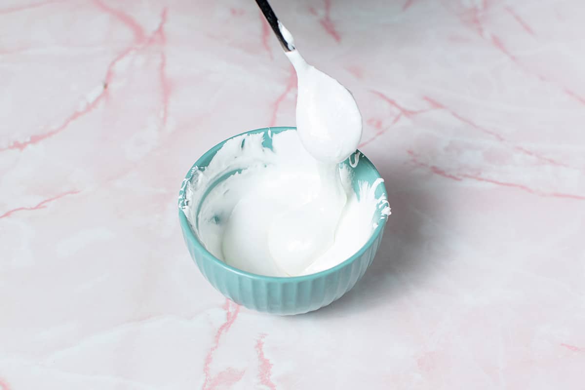 marshmallow fluff in a small blue bowl