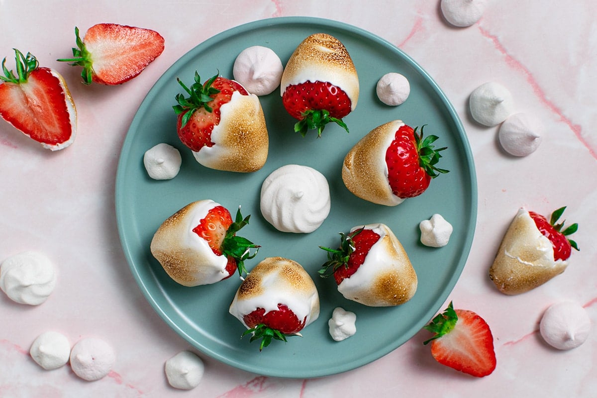 overhead shot of plate of toasted marshmallow strawberries