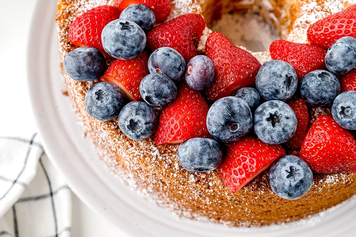 close up overhead shot of berries on angel food cake
