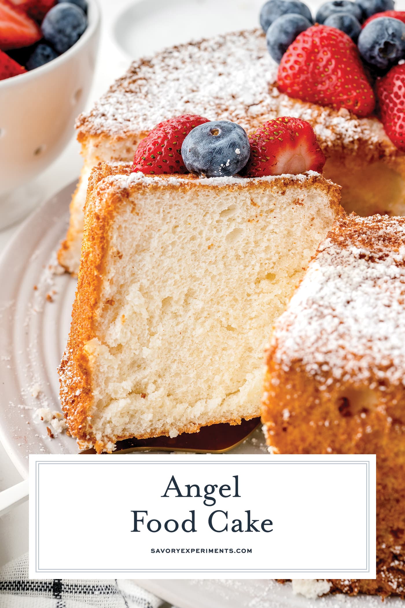 straight on shot of sliced angel food cake with text overlay for pinterest