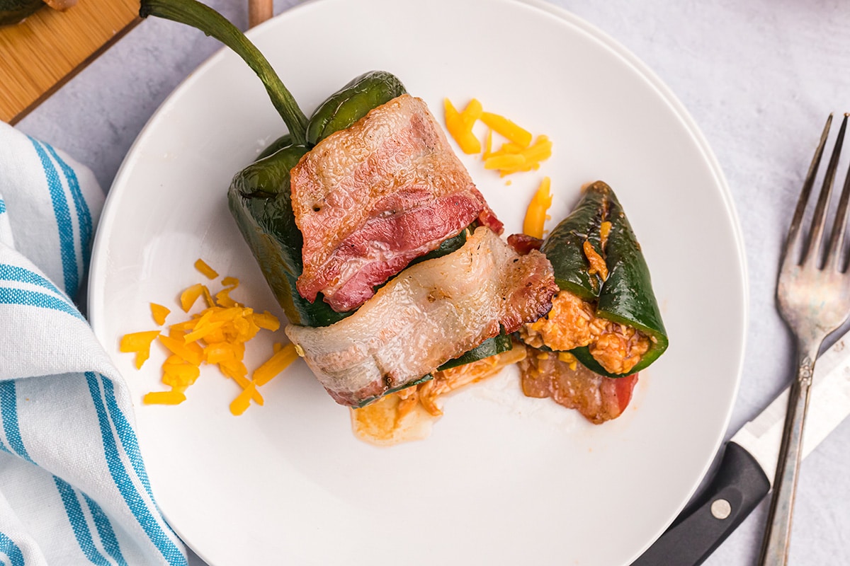 overhead shot of stuffed poblano pepper cut on a plate