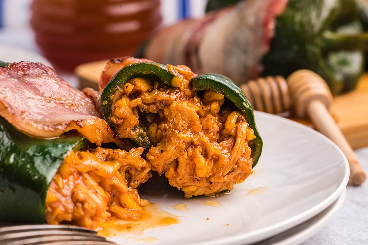 straight on shot of stuffed poblano pepper cut in half