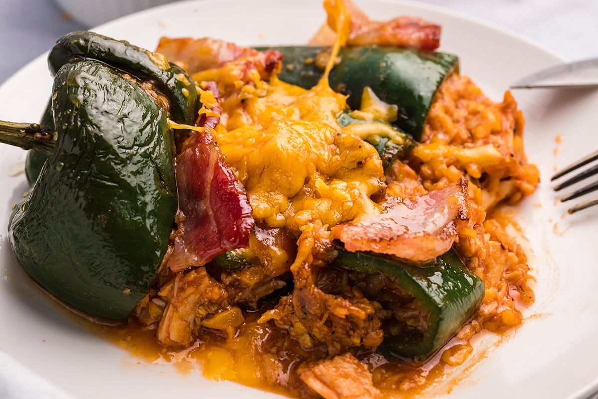 plate of cut up stuffed poblano peppers