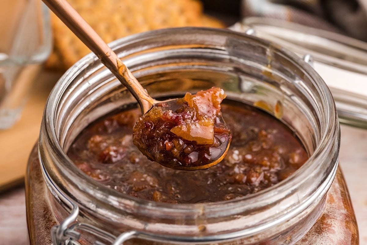 angled shot of spoon full of bourbon bacon jam