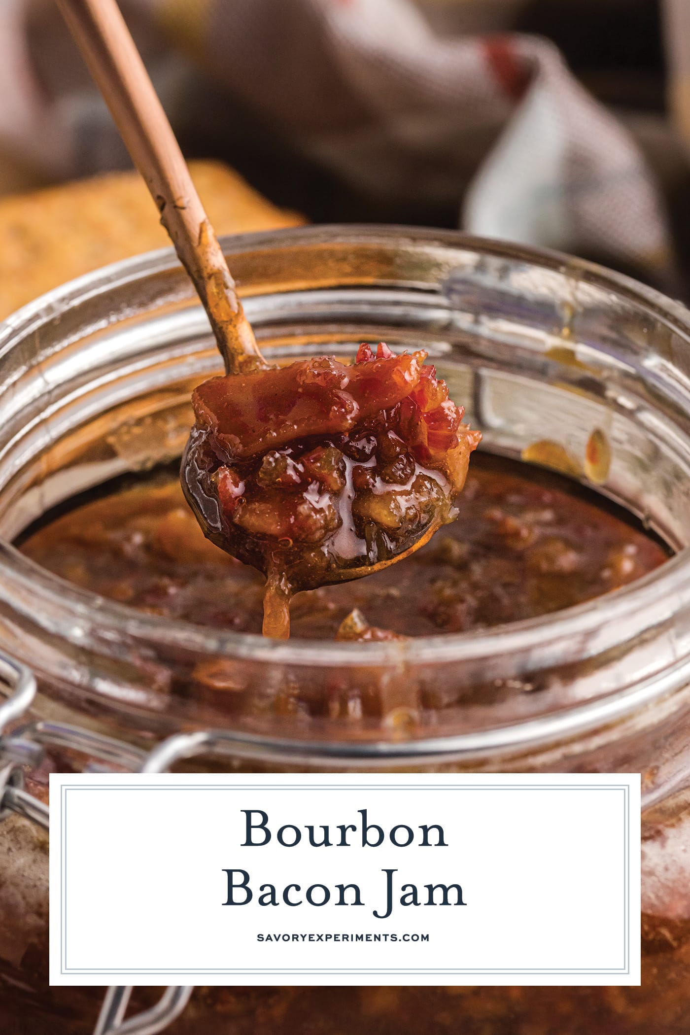 angled shot of bacon jam on spoon with text overlay for pinterest