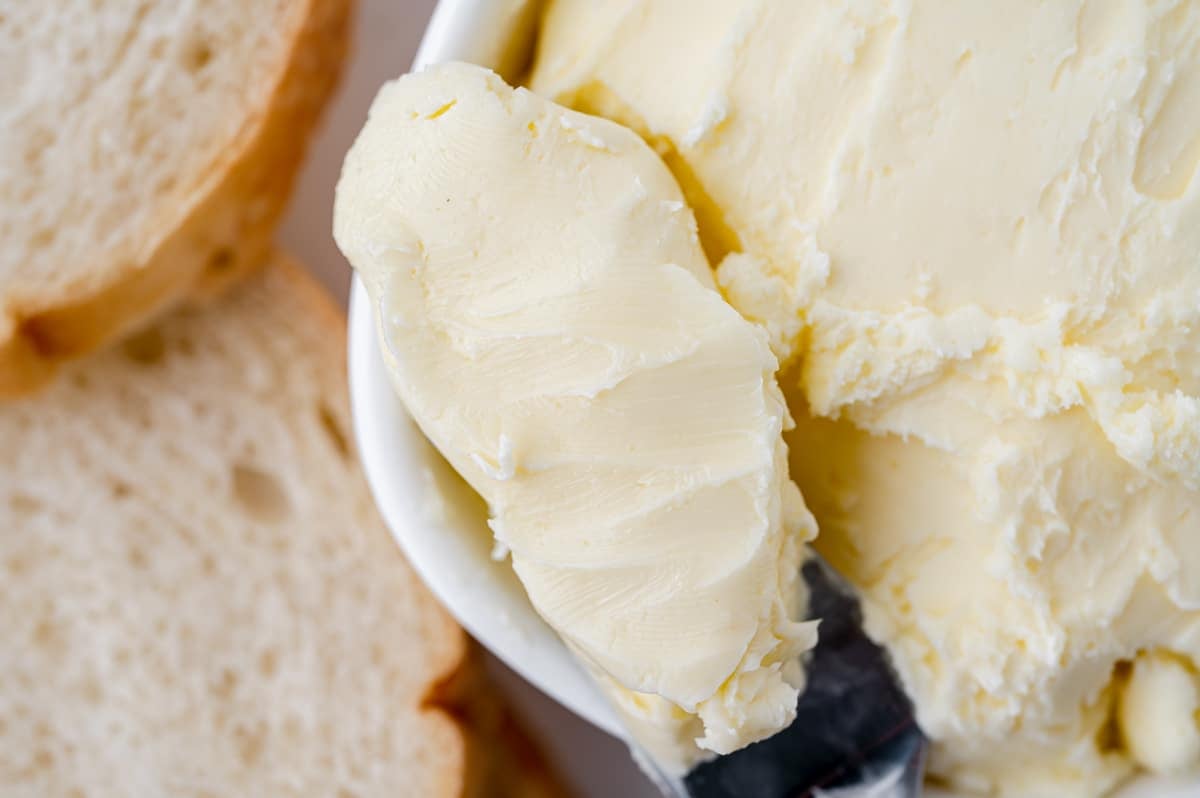 close up shot of homemade butter on a knife