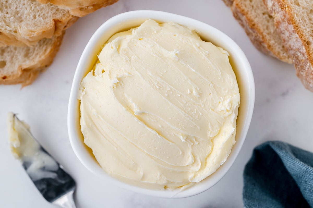 overhead shot of butter in a white bowl