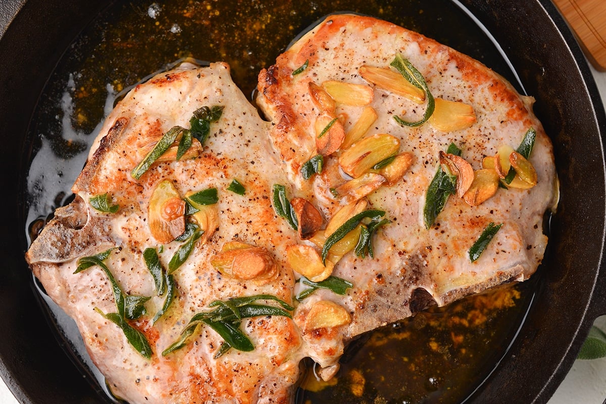 close up of cast iron pork chop recipe before serving