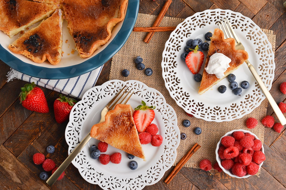 overhead shot of two slices of sugar cream pie on plates