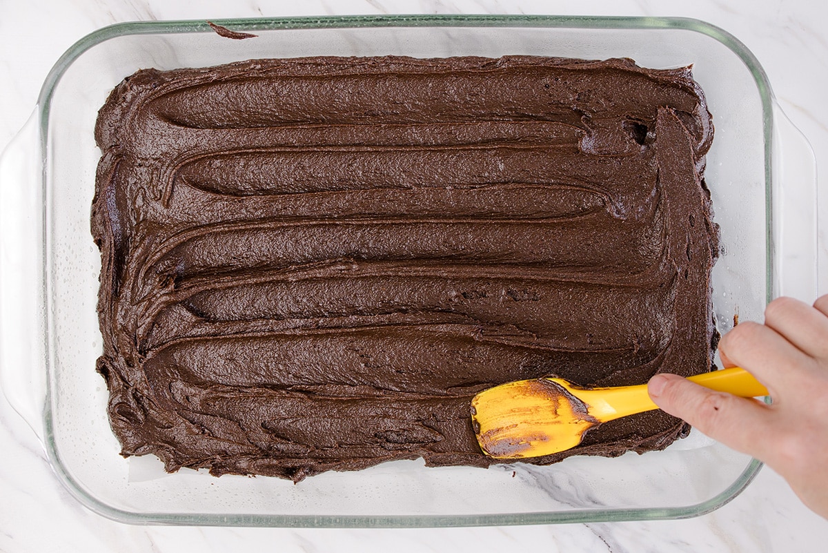 brownie batter spread into a pan