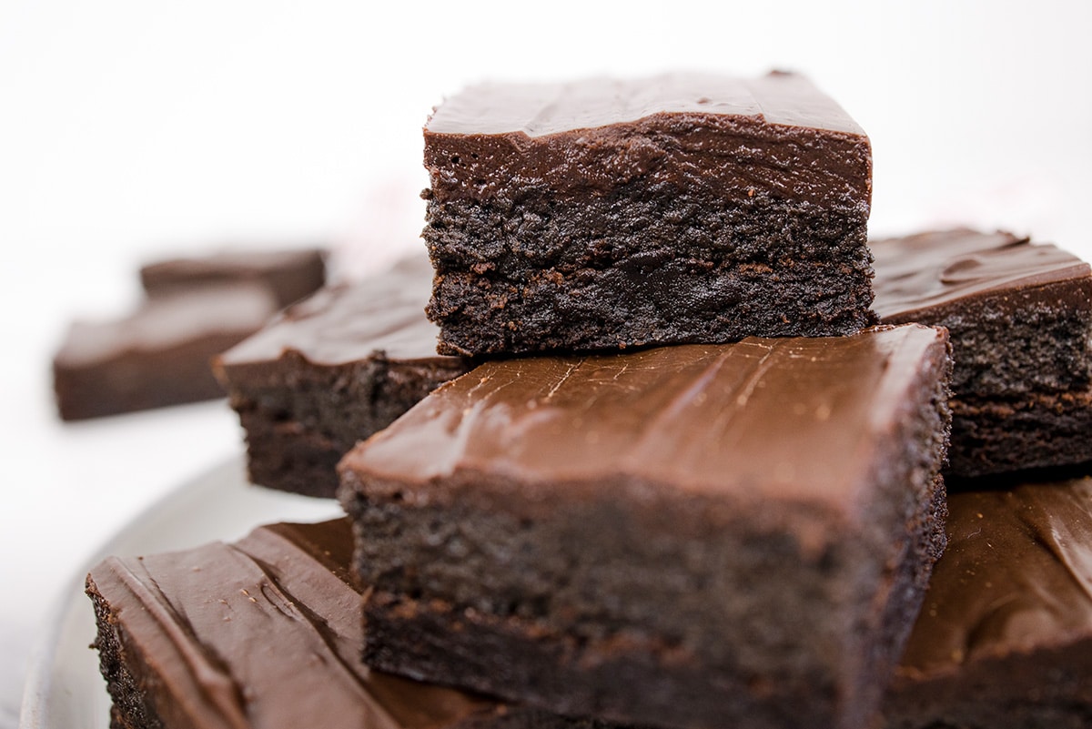 close up of stack of fudgy brownies
