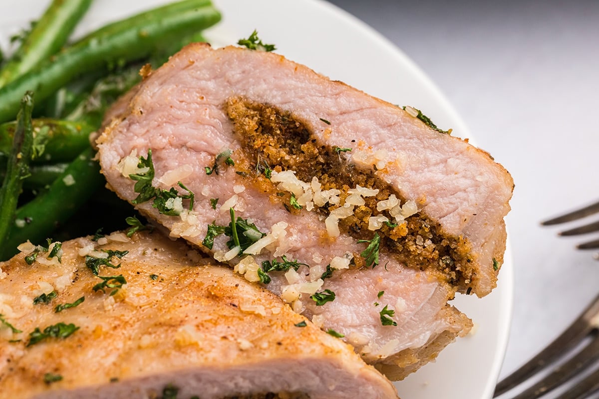 overhead close up shot of stuffed pork chop cut in half