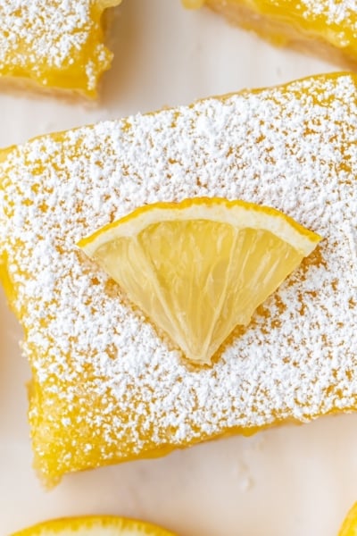 overhead shot of lemon bar slice topped with lemon