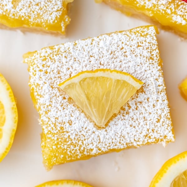 overhead shot of lemon bar slice topped with lemon