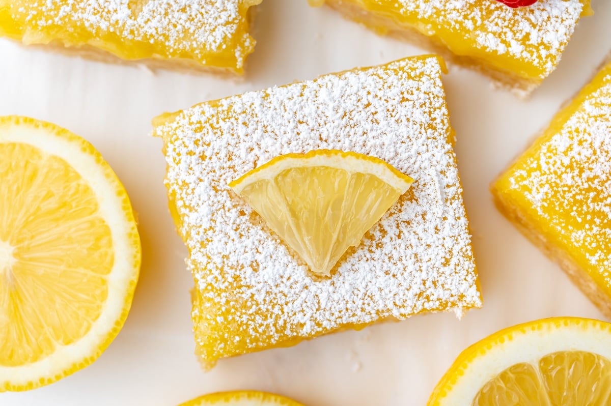 overhead shot of lemon bar slice topped with lemon
