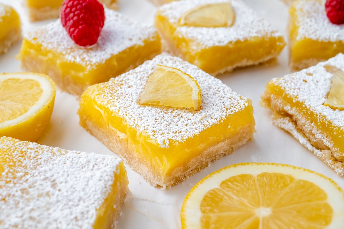 angled shot of lemon bar topped with lemon