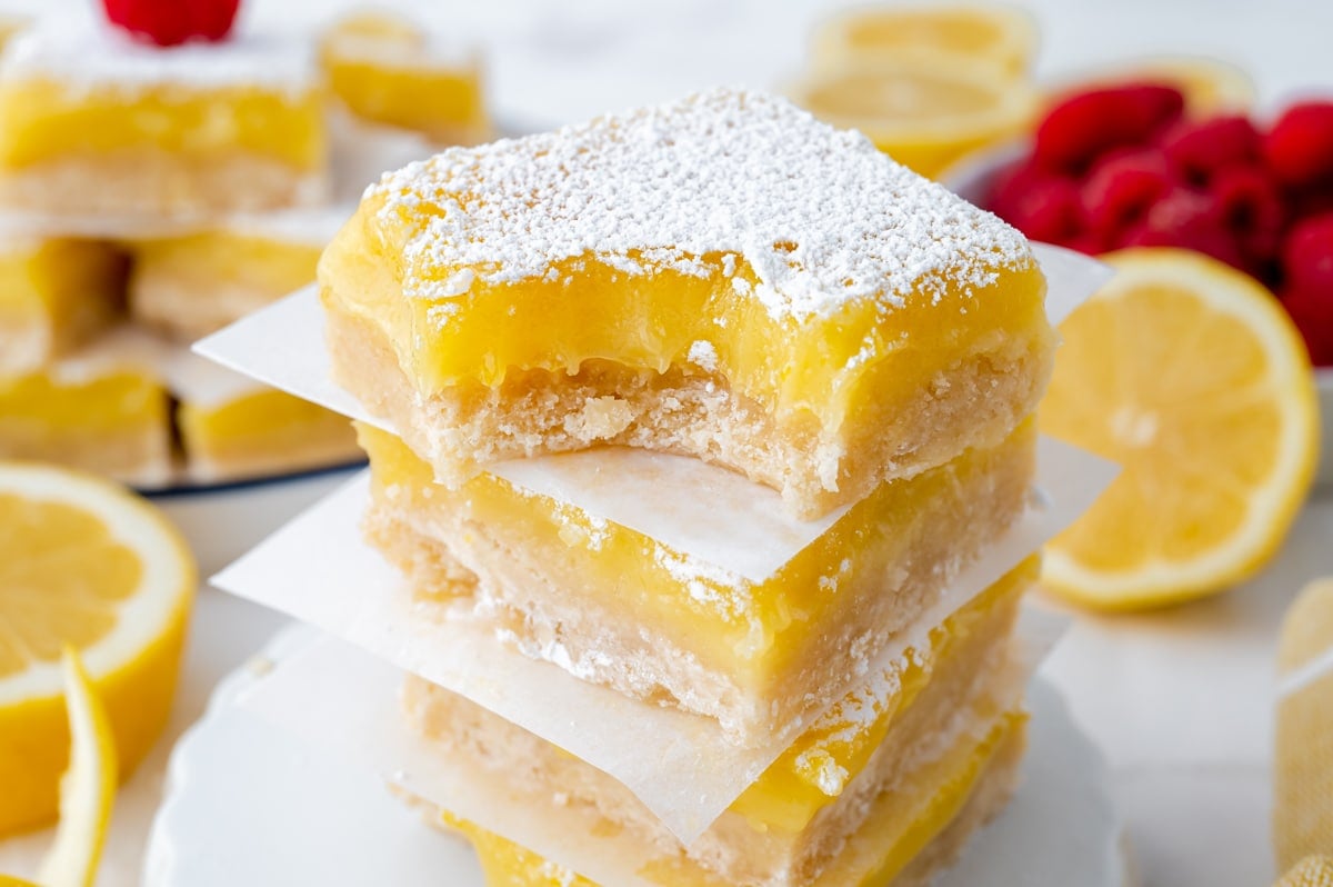 bite taken out of stack of lemon bars