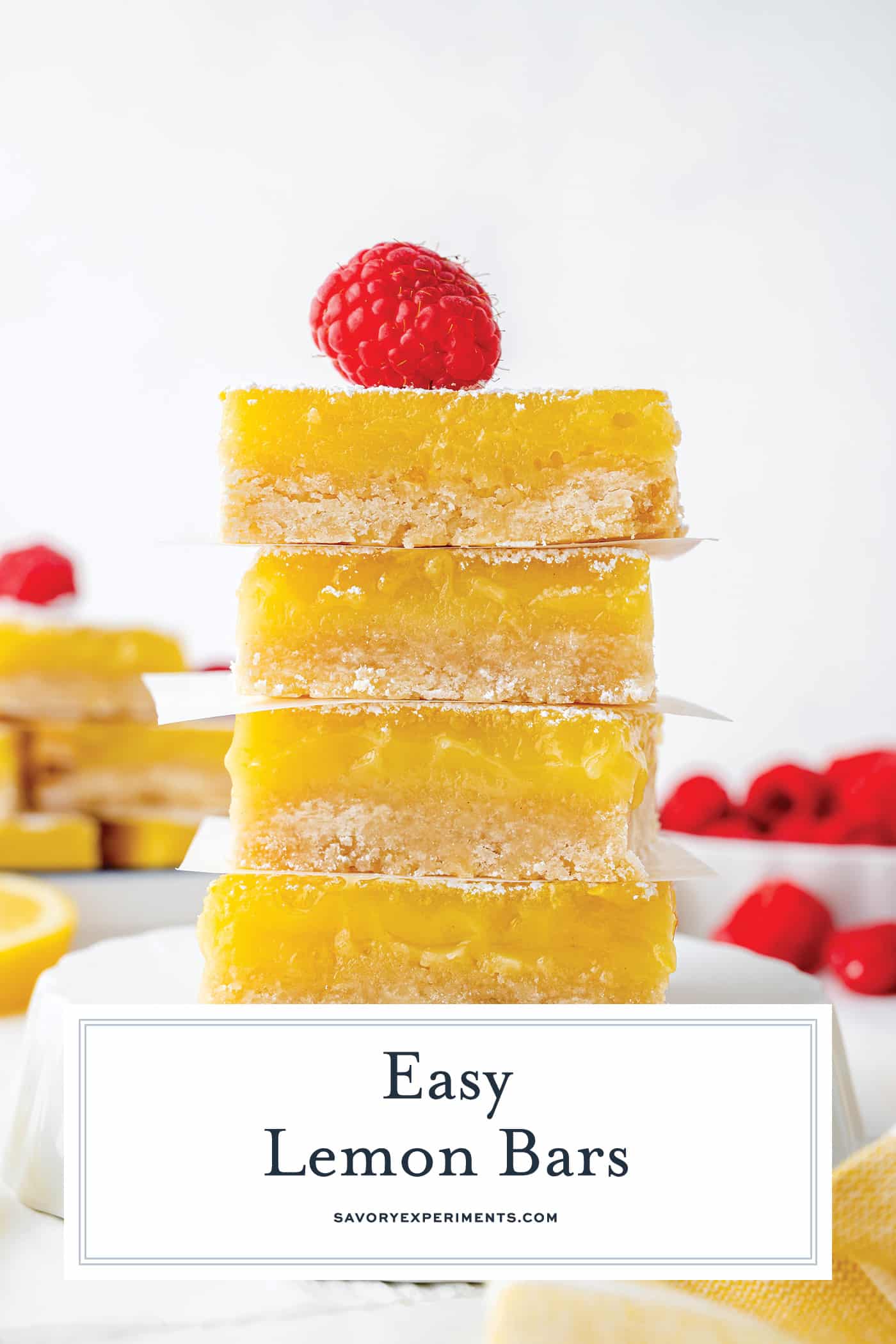 stack of lemon bars topped with raspberry with text overlay for pinterest